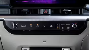 A clean panel with touch AC buttons and rotary dials for blower and temp makes the cabin feel clutter-free.